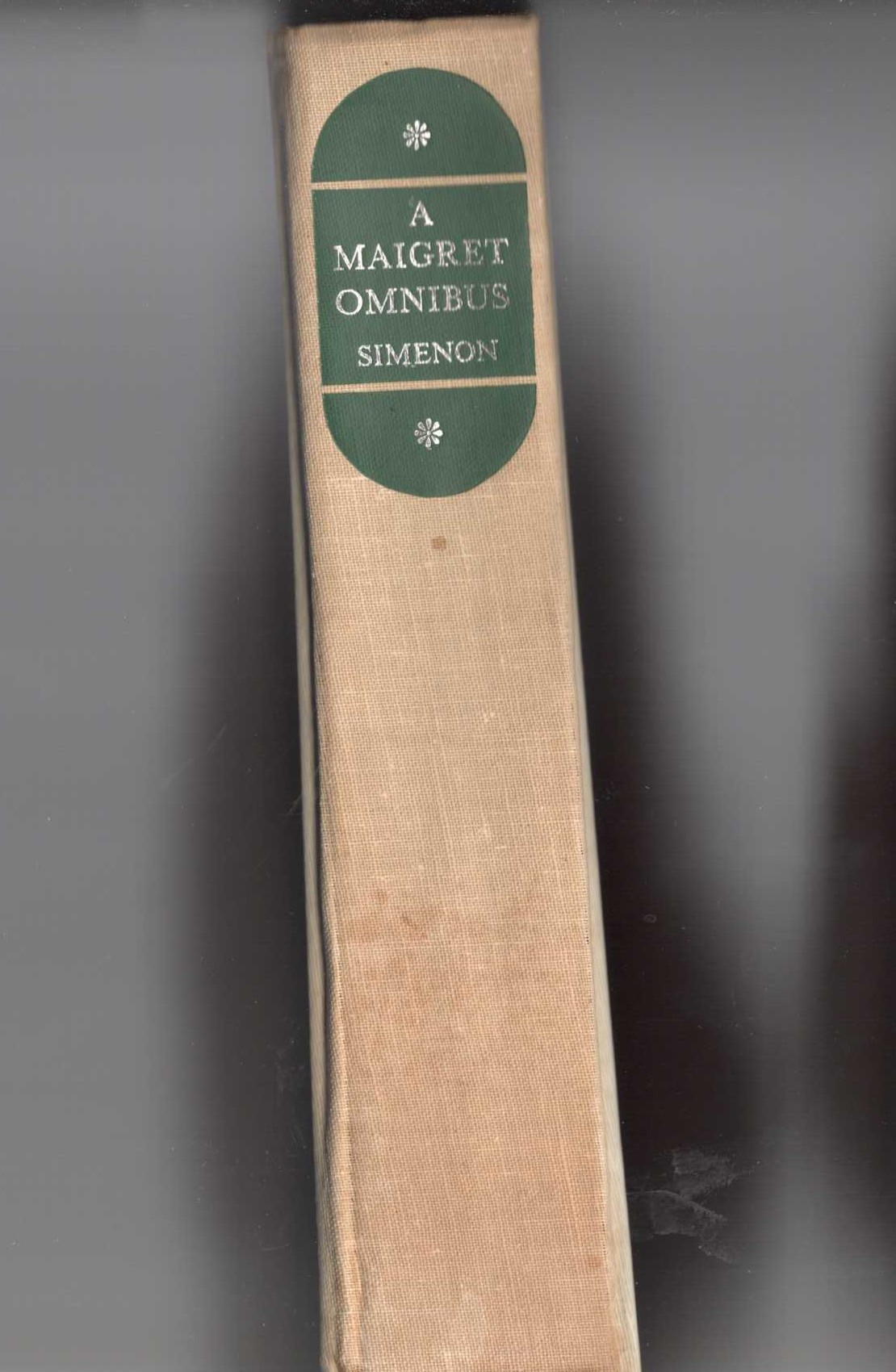 A MAIGRET OMNIBUS: MAIGRET RIGHT AND WRONG [MAIGRET IN MONTMARTRE & MAIGRET'S MISTAKE]/ MAIGRET HAS SCRUPLES/ MAIGRET AND THE RELUCTANT WITNESSES/ MAIGRET GOES TO SCHOOL front book cover image