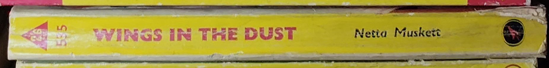 Netta Muskett  WINGS IN THE DUST spine of book image