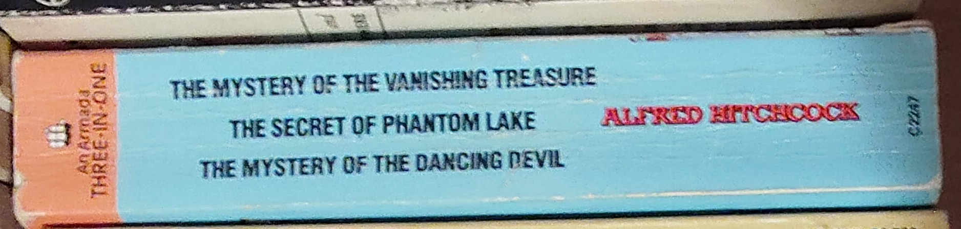 Alfred Hitchcock (introduces_The_Three_Investigators) THE MYSTERY OF THE VANISHING TREASURE/ THE SECRET OF PHANTOM LAKE/ THE MYSTERY OF THE DANCING DEVIL spine of book image