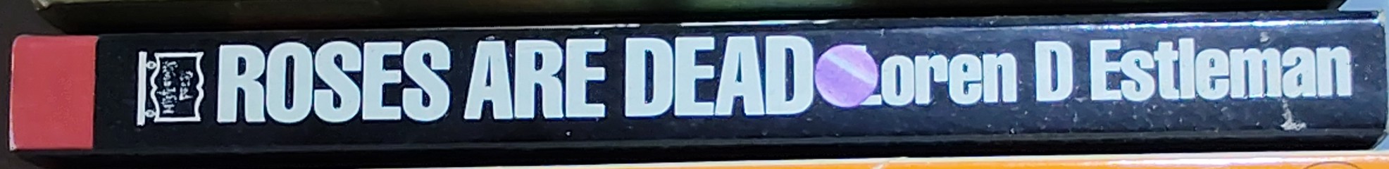 Loren D. Estleman  ROSES ARE DEAD spine of book image