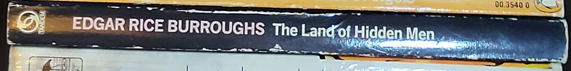 Edgar Rice Burroughs  THE LAND OF HIDDEN MEN spine of book image