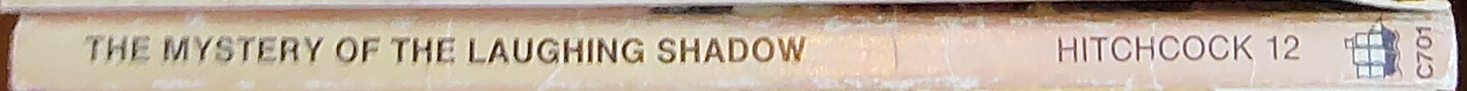 Alfred Hitchcock (introduces_The_Three_Investigators) THE MYSTERY OF THE LAUGHING SHADOW spine of book image