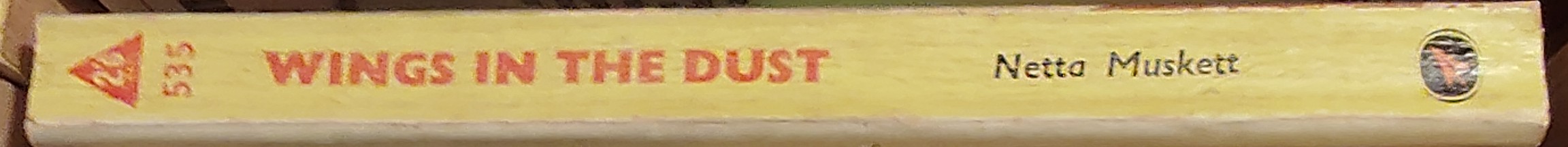 Netta Muskett  WINGS IN THE DUST spine of book image
