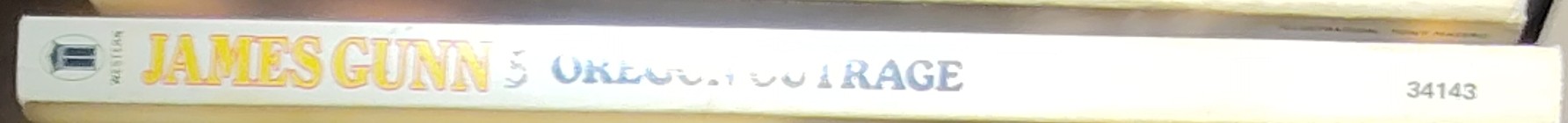 John Delaney  JAMES GUNN 5: OREGON OUTRAGE spine of book image