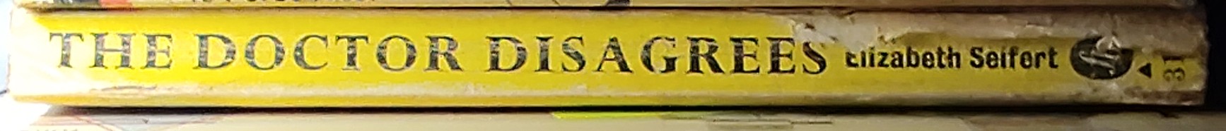 Elizabeth Seifert  THE DOCTOR DISAGREES spine of book image