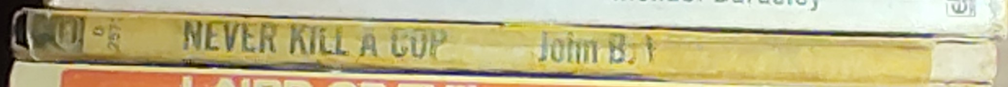 John B. West  NEVER KILL A COP spine of book image