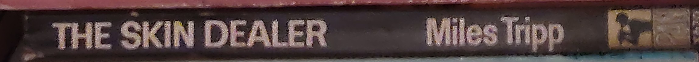 Miles Tripp  THE SKIN DEALER spine of book image