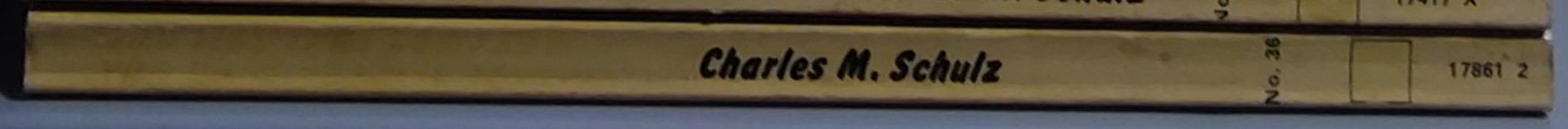 Charles M. Schulz  WHO WAS THAT DOG I SAW YOU WITH, CHARLIE BROWN? spine of book image