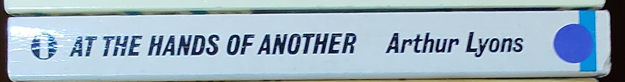 Arthur Lyons  AT THE HANDS OF ANOTHER spine of book image